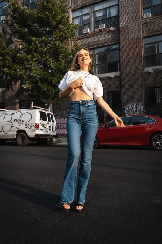 White blouse and flared jeans on a Brooklyn street