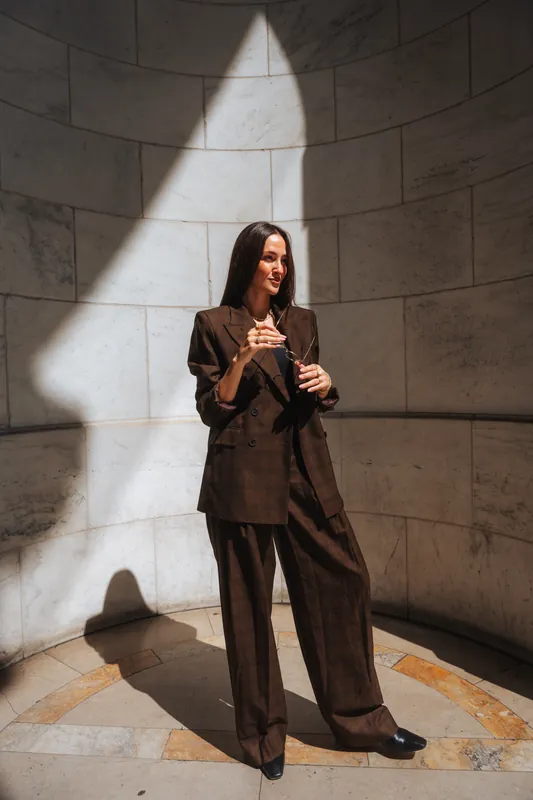 Model wearing EFFY jewelry outside the New York Public Library