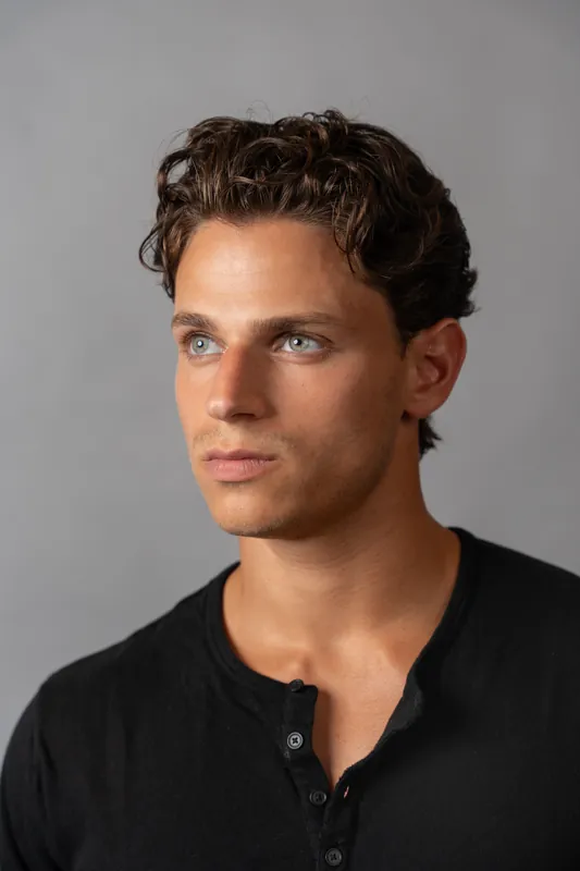 Black henley, three quarter profile on grey