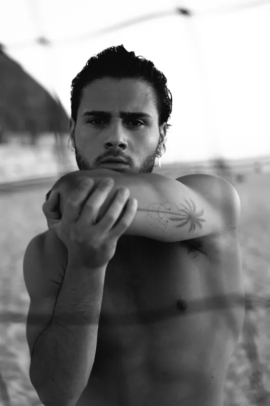 Black and white beach portrait, arm across the chest, Israel