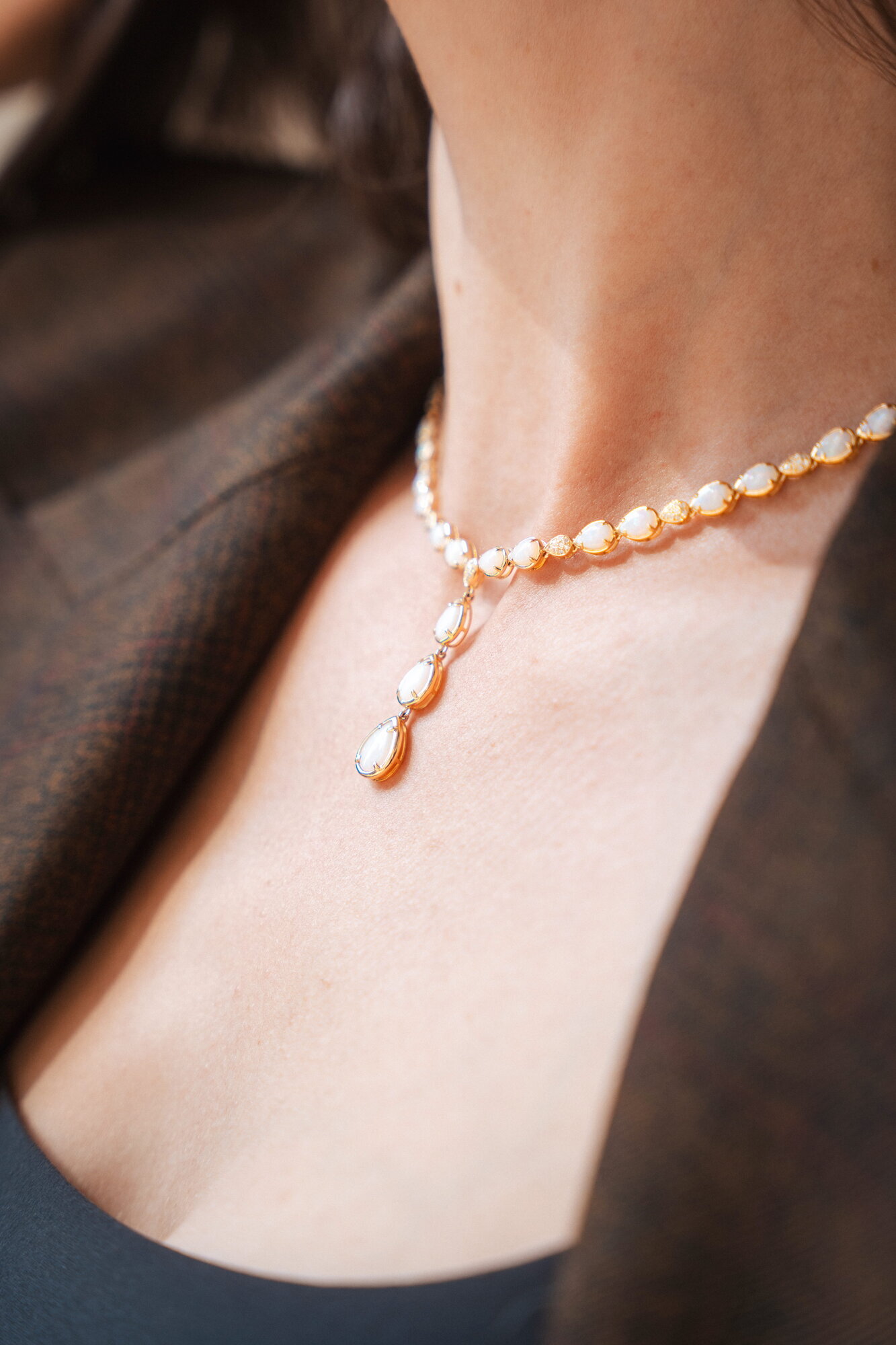 Close-up of an EFFY pearl drop necklace on a model's neckline
