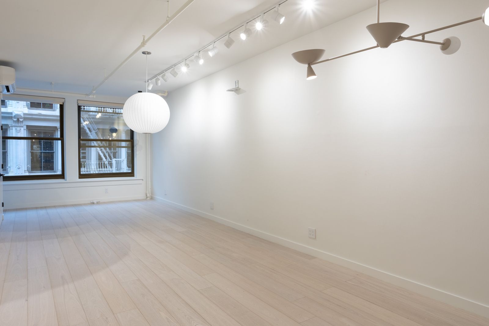 Before: a gallery style loft living room, empty